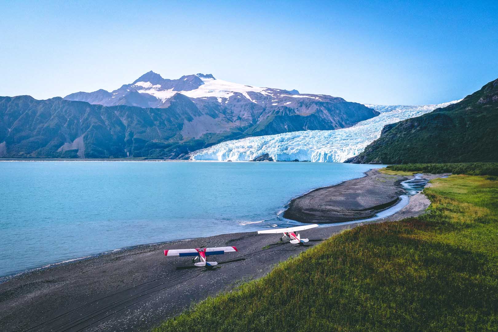 FLY8MA bush plane in flight over Alaska wilderness — flight training available